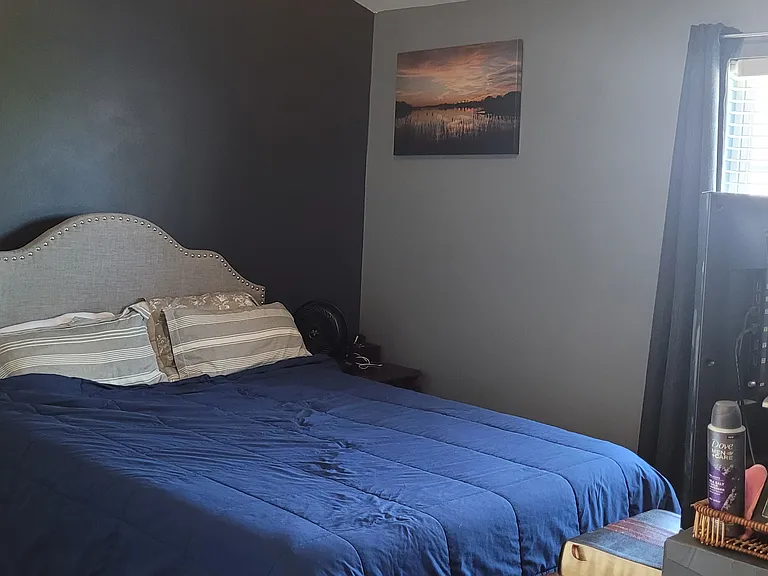 Bedroom w/ furniture.