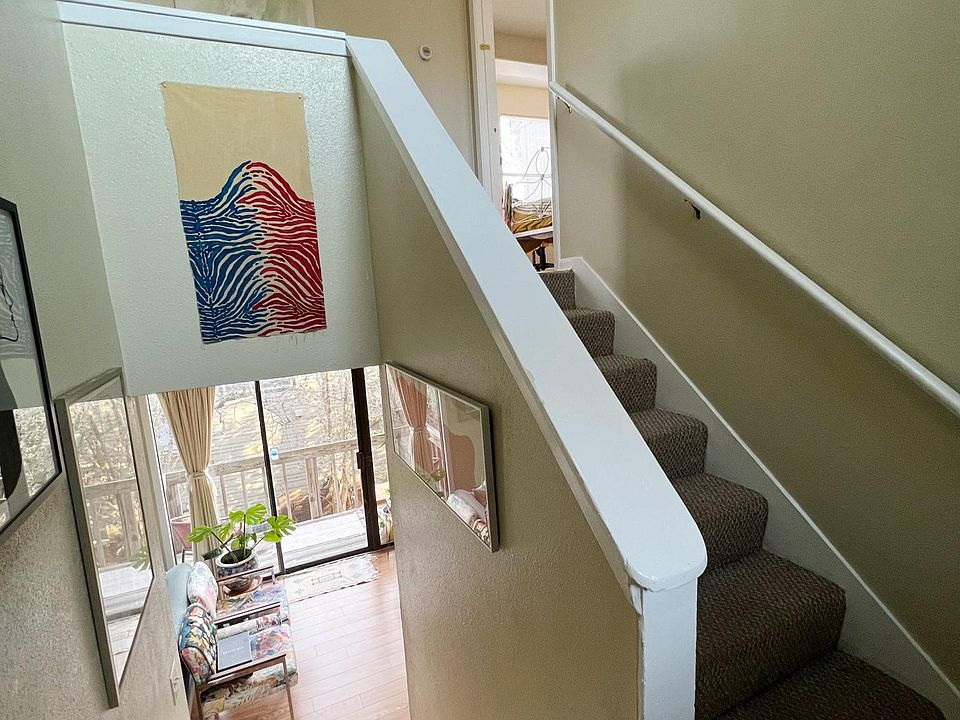 Entrance area. Bedrooms and baths upstairs. Main level with living, dining,kitchen and utility room down.