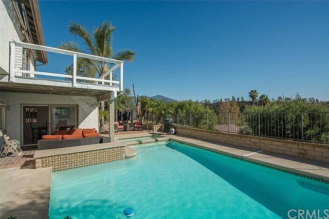 Enjoy the view from your large backyard with pool/spa!