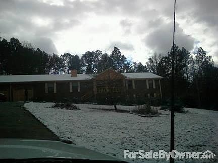 Front veiw of home
						:
						house sits between the 3 acre with a 500ft drive way.