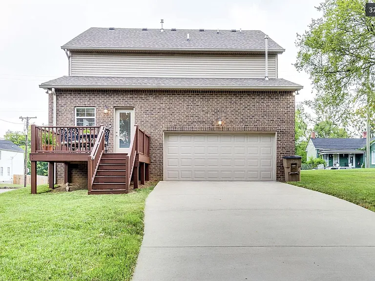 Situated on a corner lot with deck, private driveway and 2-car attached garage.