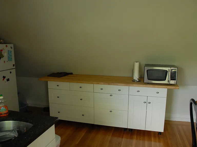 Part of the Kitchen with painted white cabinets