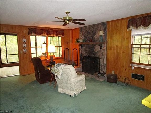 Large living area with stone fireplace