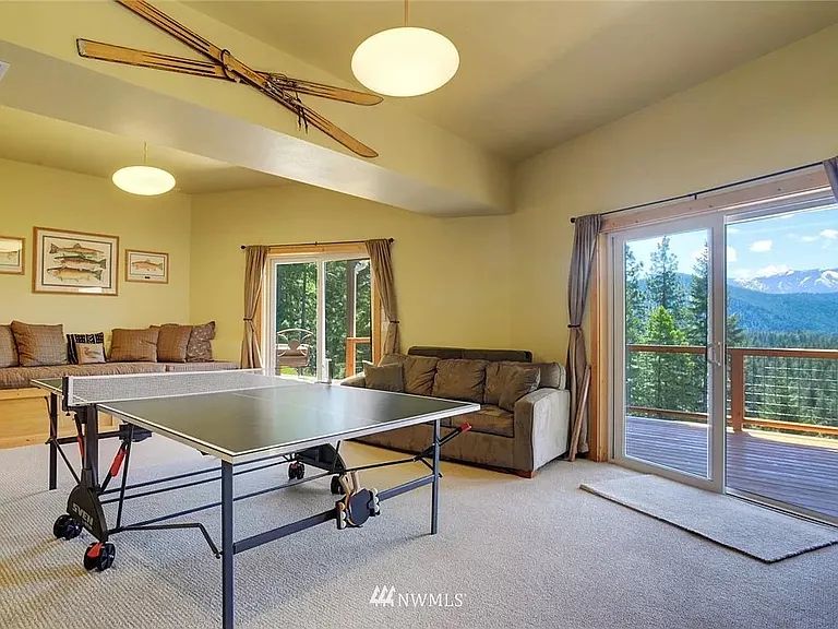Basement recreation/family room with ping pong table. Very spacious with great views.