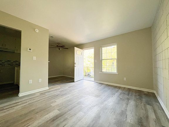 Step into a bright and sunny day from this inviting living room.