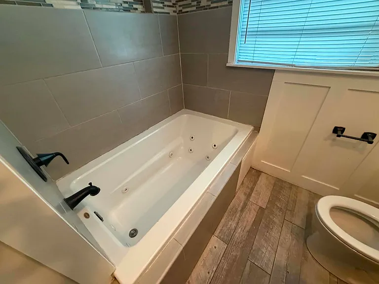 Luxurious Jetted soaker tub and Tile surround