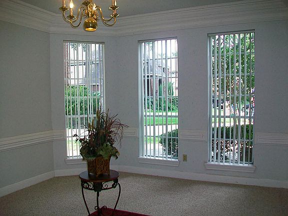 FORMAL DINING IS BANQUET SIZE WITH CHANDELIER