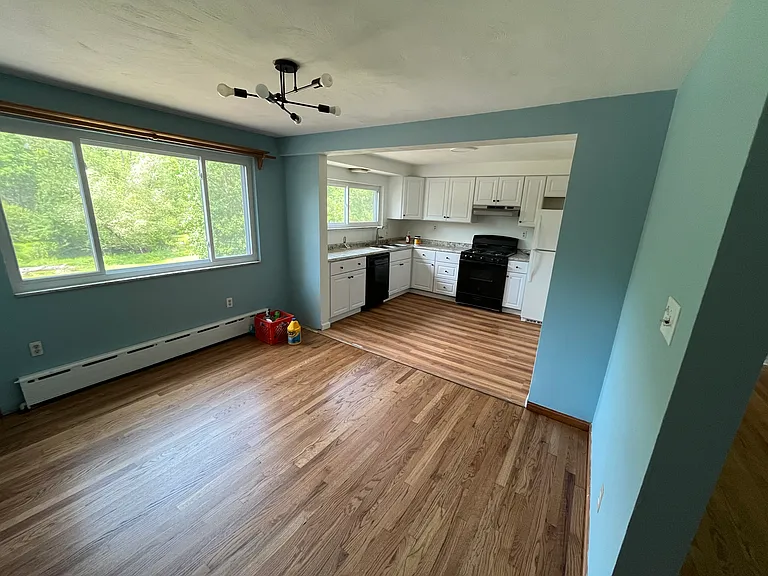 Large eat-in kitchen area with new cabinets and counters.