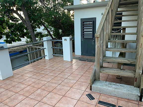Private entrance with terraced deck.