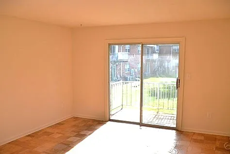 Living Room with sliding glass doors outside to balcony to relax!
