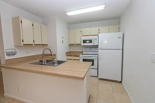 18304 NW 68th Ave #L Photo 1