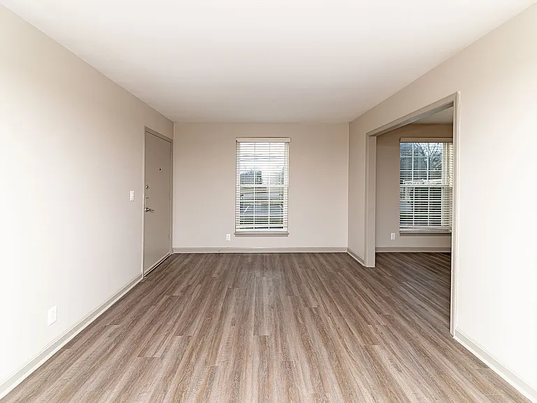 Spacious living room with hardwood-style flooring