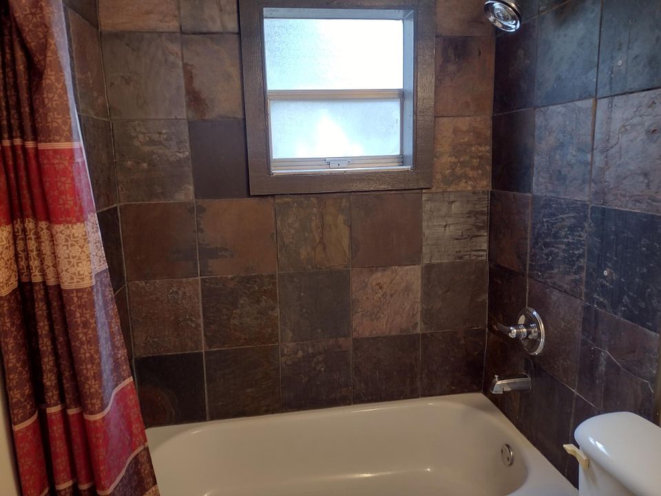 slate tiled shower/tub