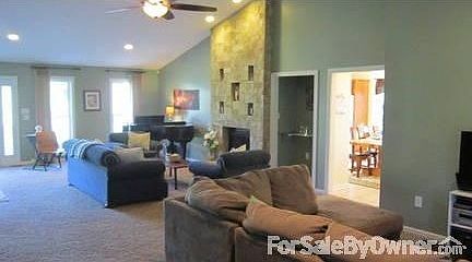 Living Area
						:
						Floor to ceiling fireplace adds a focal point and design.