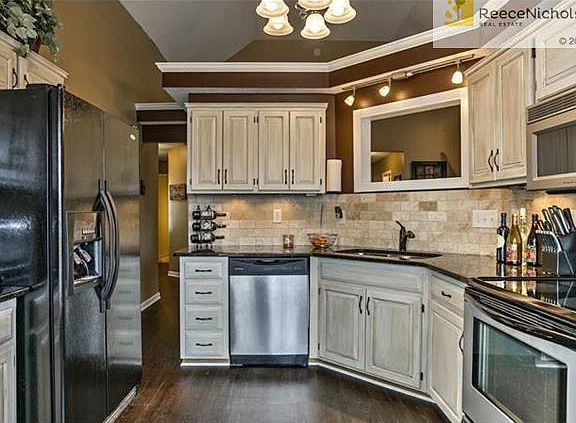 New granite, cabinets, and backsplash in the kitchen.