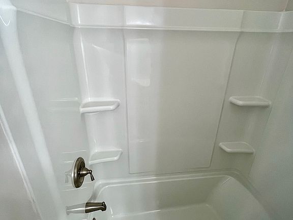 EVERYTHING BRAND NEW! Brand-new shower head, upgraded water pressure, and brand-new full surround with more shelves than you could ever need!