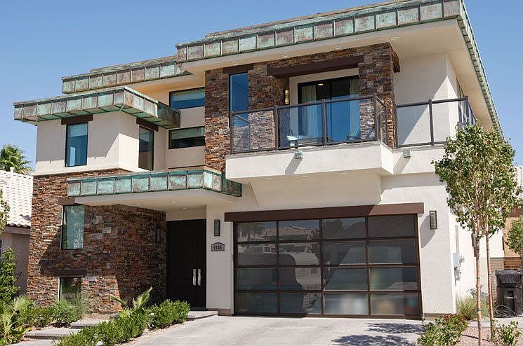 Front of the home.Custom stonework with wrap around balcony with gorgeous view