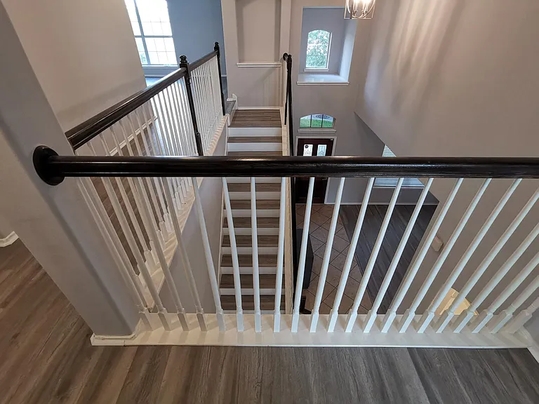 elegant open staircase that connects downstair with upstairs living