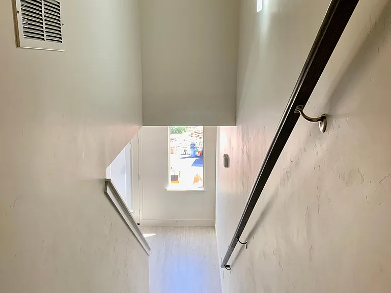 staircase #2 leading to primary suite on 3rd floor