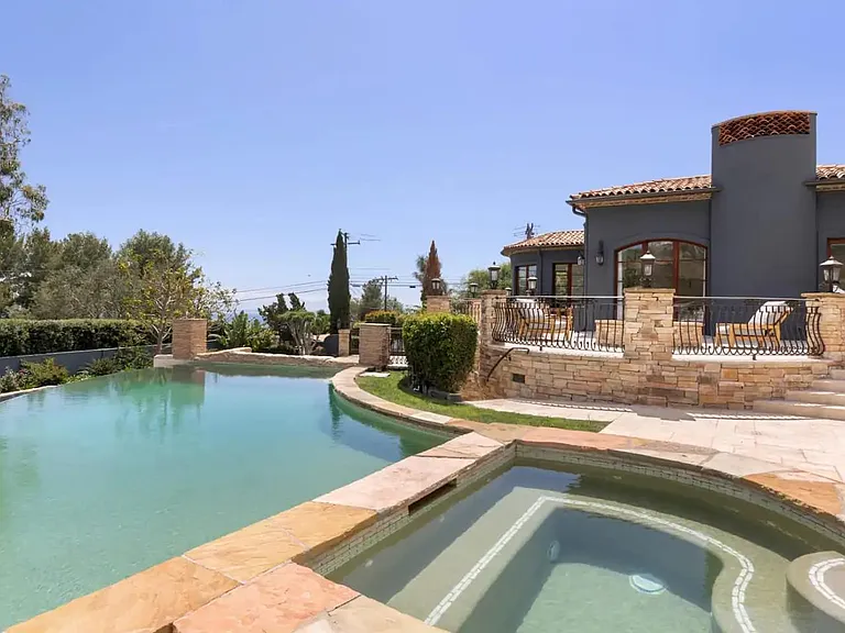 Dive into the infinity edge pool or relax in the spa.