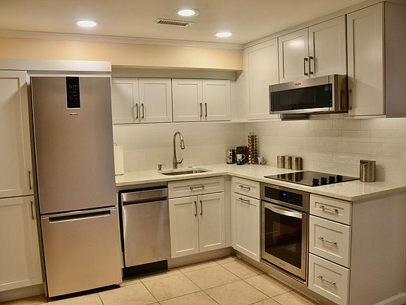 Brand new kitchen with all accessories (pots pans, blenders toaster three types of coffee makers) includes dishwasher and oven.