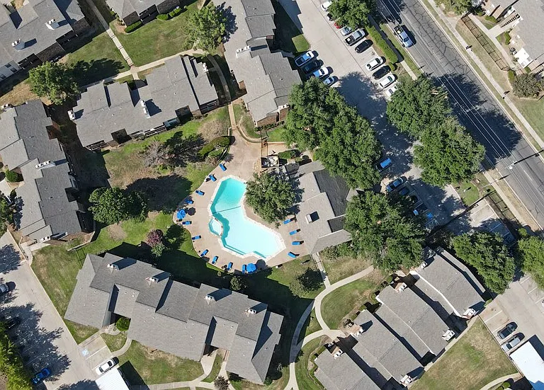 Aerial view of the community showcasing layout, green spaces, and amenities