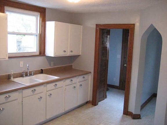 Kitchen looking into the mud room and breakfast nook