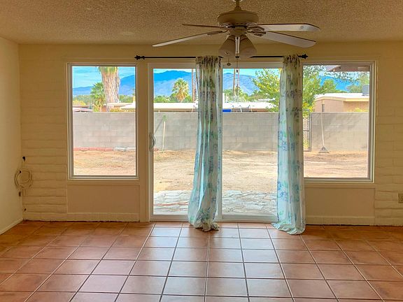 Living room space - Did I mention the great views of the Rincon mountains, well theres more, if you step outside you get amazing views of the Santa Catalina Mountains. - Sliding door. - Fan with light