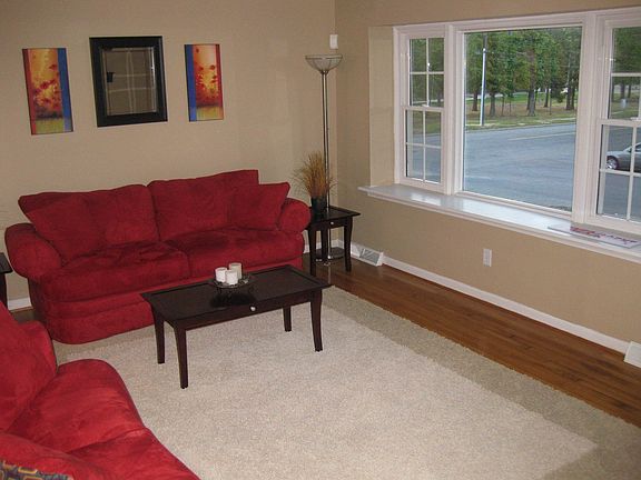 Living room features a large picture window