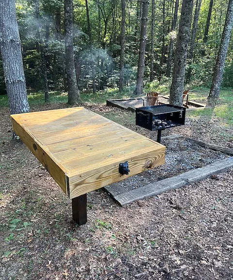 park style BBQ and we built this handy table to use while BBQing... bear head on table is a bottle opener.
