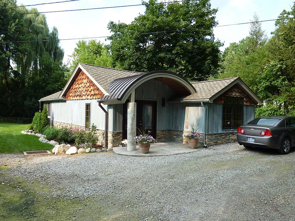 Front of home, parking for two cars in front