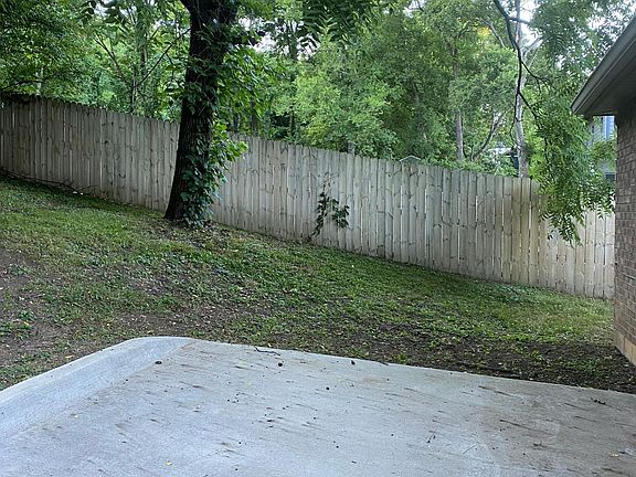 Private parking behind apartment and back yard view.