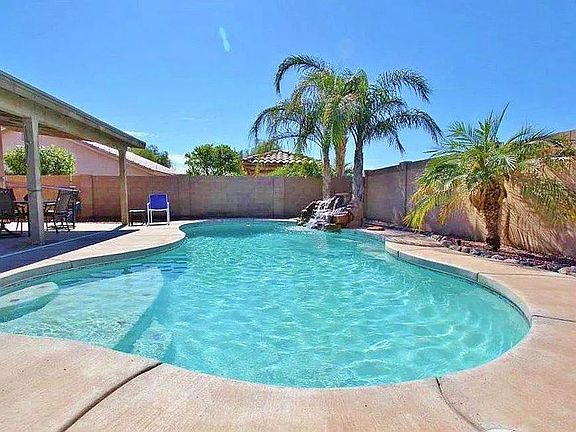 Swimming pool with waterfall