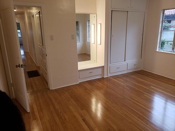 Master with built in Vanity with new LED lights, Closets with upper and lower storage, and newly redone hardwood floors throughout