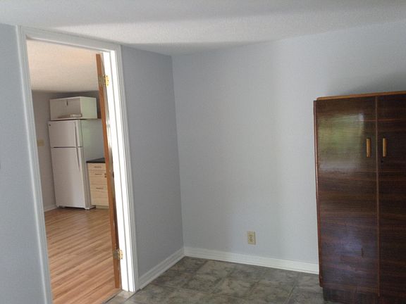 Tiny 7' by 12' bedroom.