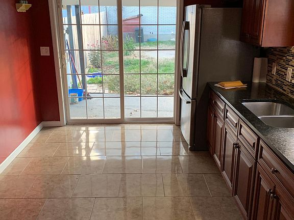 The view from the eat in kitchen to the backyard. Plenty of light and air