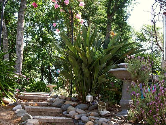 Another path to upper level (pool, hot tub, deck).