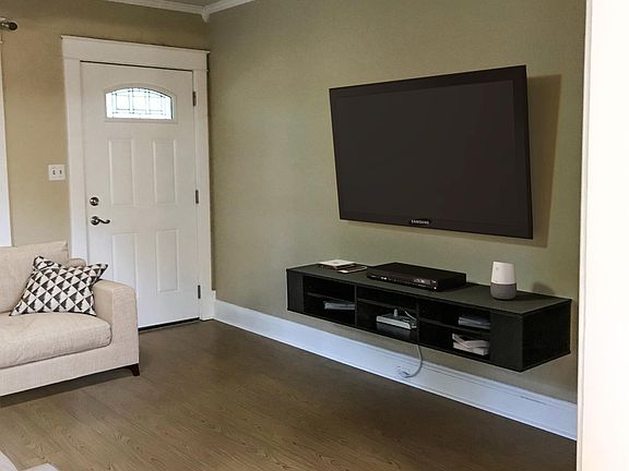 The home comes with in-wall wiring for phone, cable and ethernet connections in every room including the kitchen as well as a floating entertainment console and wall tv mount.