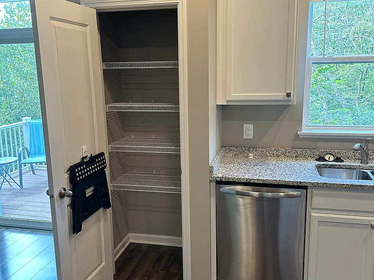 Closet style pantry in the kitchen.