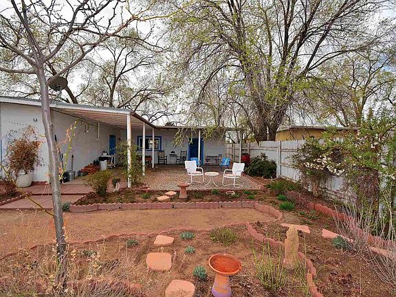 Covered porch and large courtyard area to enjoy a cup of coffee in the morning or evening cocktail.