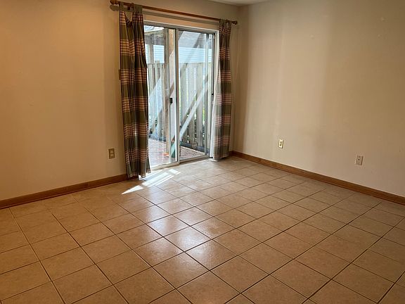 First floor bedroom, with walk out door to fenced back yard.