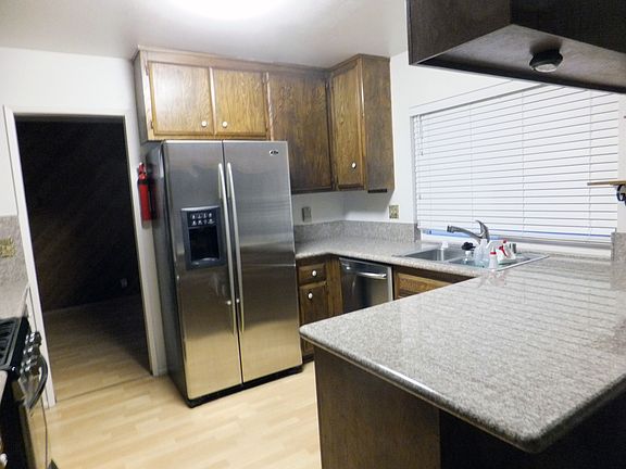 Kitchen with granite countertops and stainless steel appliances!