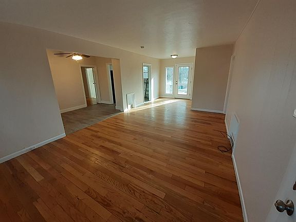 Living room and dining room looking toward the back door