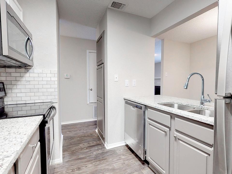 Kitchen with all new stainless steel appliances, granite countertop, marble backsplash, brush nickel/chrome hardware in selected units