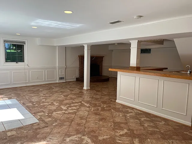 Lower Level: Large recreational area with convenient built-in counter and sink