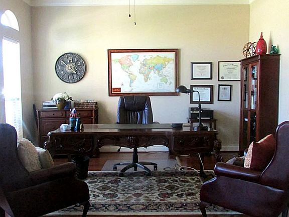 Large study with with crown molding and wood flooring!