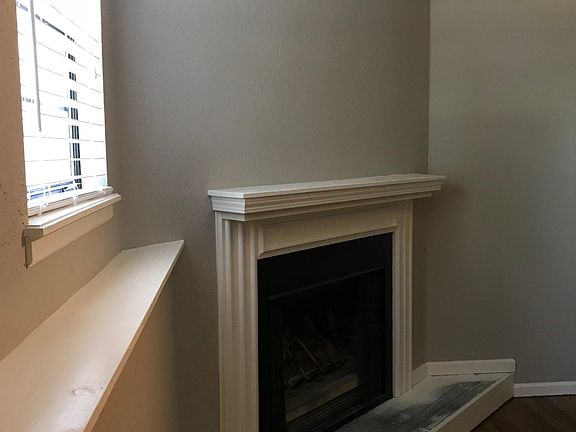 Wood burning fireplace in family room, new plank flooring c