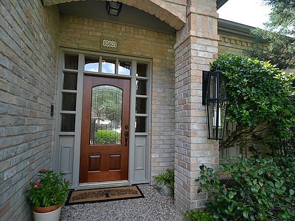 This inviting entrance has a beautiful glass door, transom and sidelights. Double paned windows in t