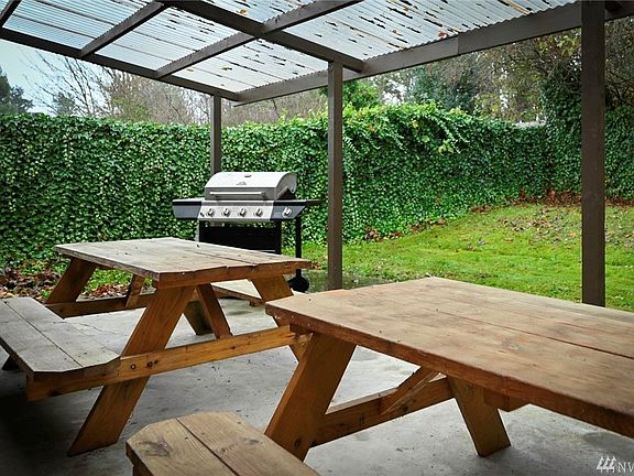 Large 12x30 fully covered back patio with lighting and plumbed gas line for a bbq or fire table.  Great for entertaining and al fresco dining year-round.