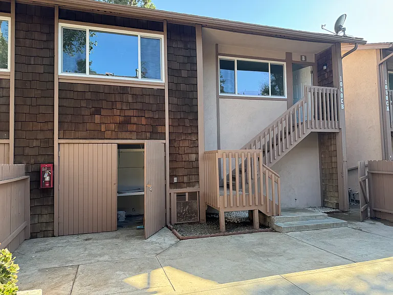 Exterior of the unit from the yard. Storage shown on the left.